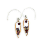 Pair of earrings with gemstones on a white background