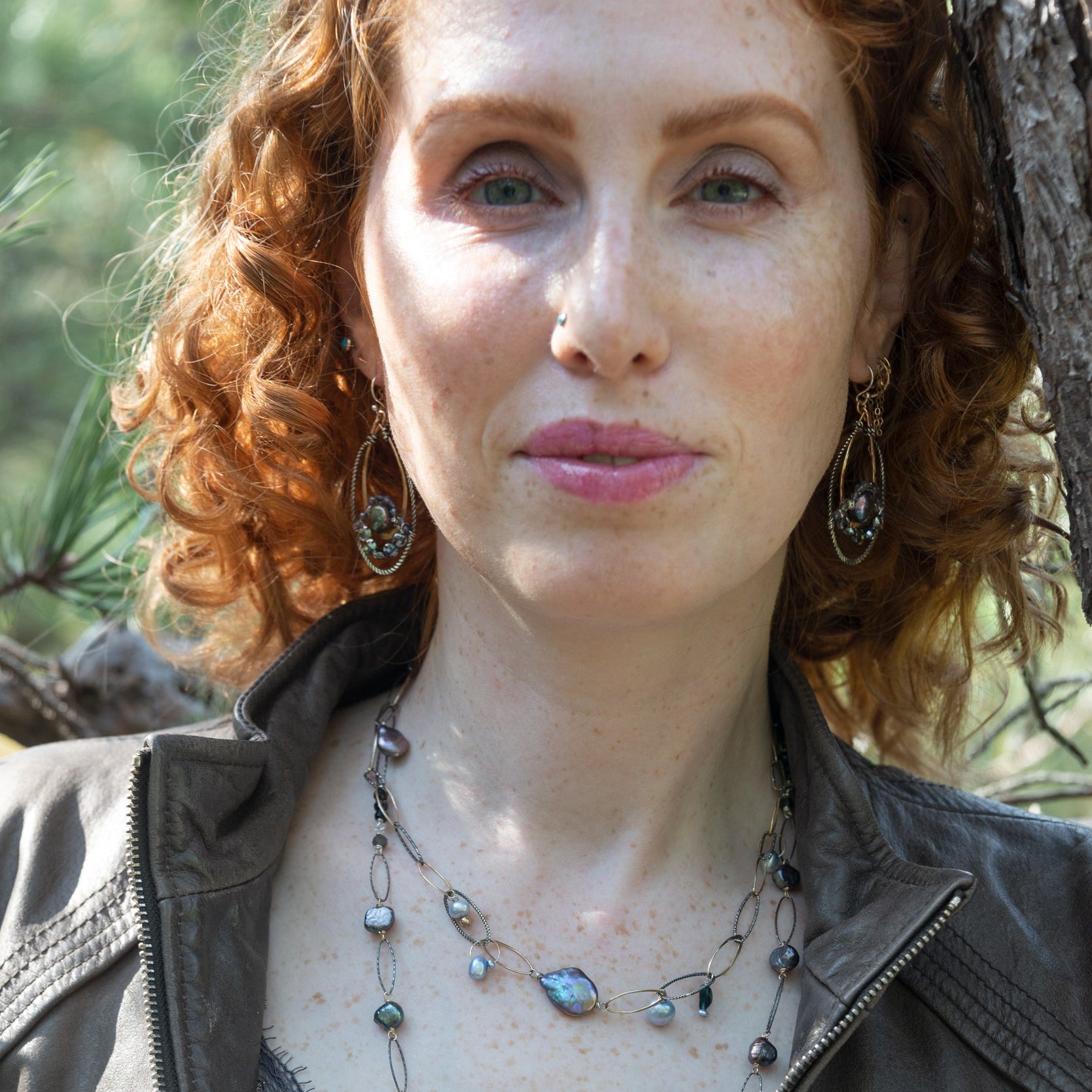 Purple/blue fresh water pearl array, gold-filled links, and sparkly oxidized sterling silver links to form a charm necklace