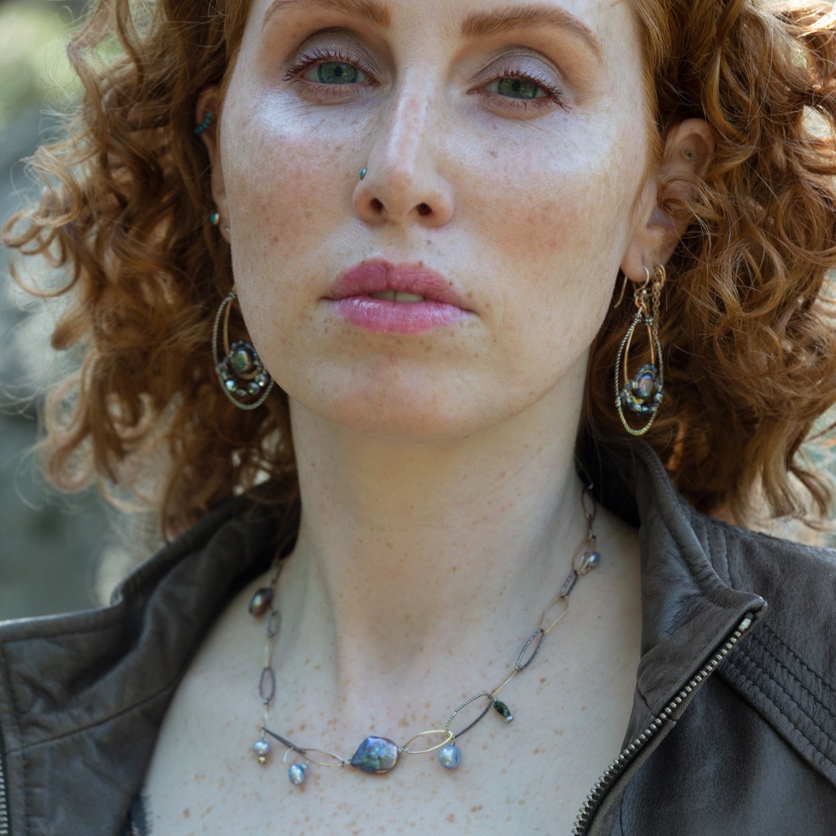 Purple/blue fresh water pearl array, gold-filled links, and sparkly oxidized sterling silver links to form a charm necklace