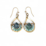 Gold earrings with green agate gemstones on a white background