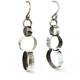 A pair of sterling silver hammered band ring earrings with French hooks.