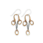 Gold and silver chain earrings on a white background