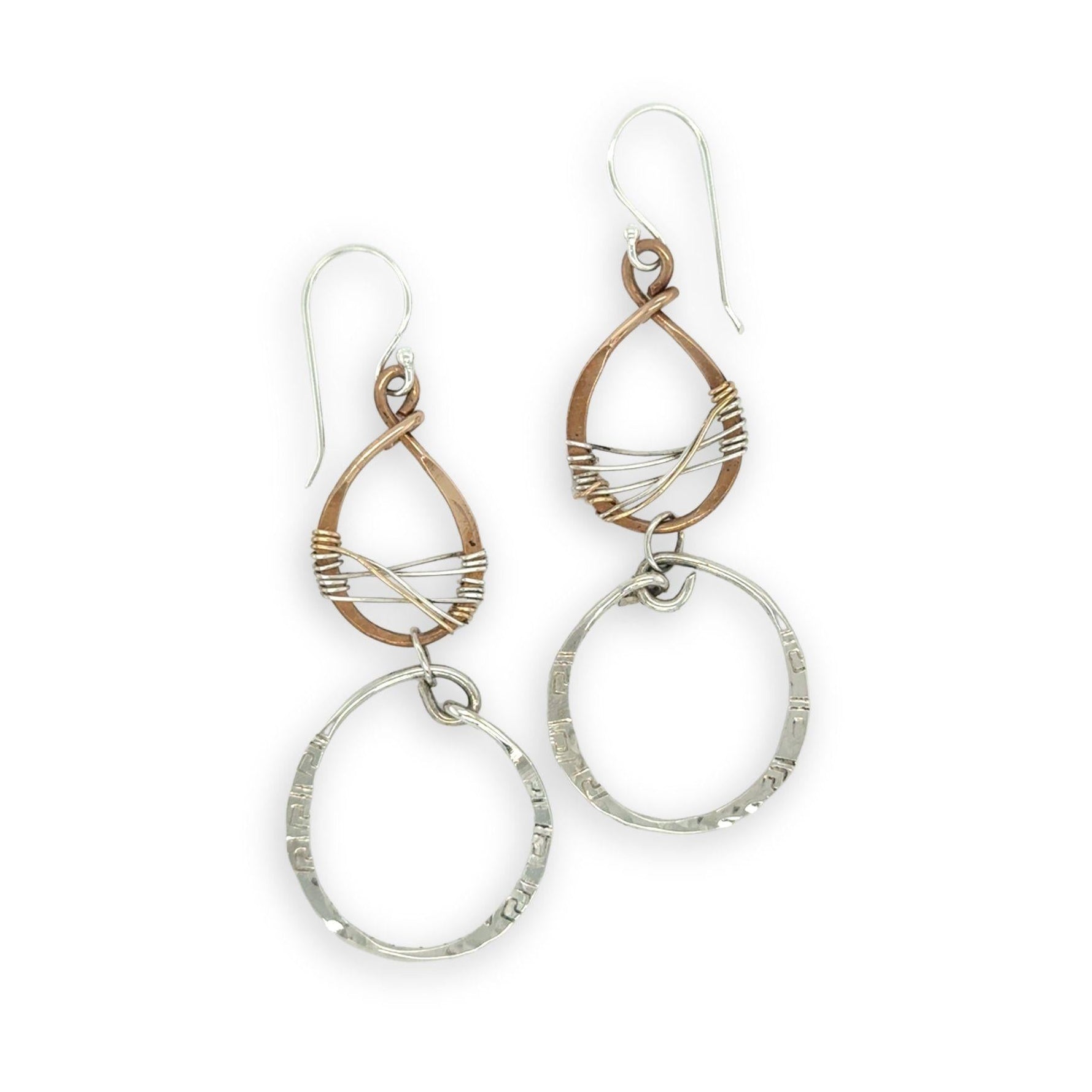 Handmade stamped sterling silver hoops hanging from bronze drops braided with sterling silver fine wire