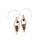 Pair of earrings with gemstones on a white background