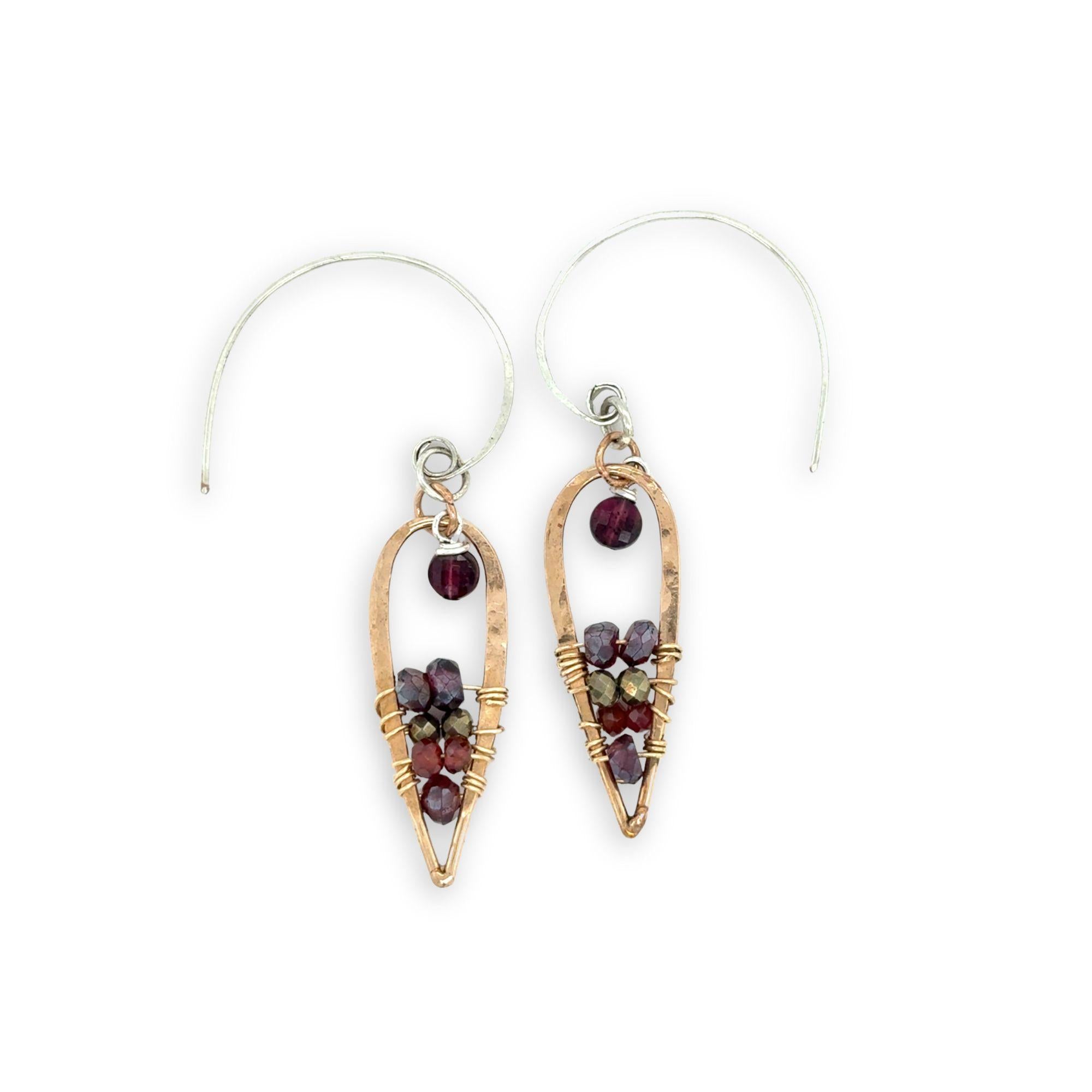 Pair of earrings with gemstones on a white background