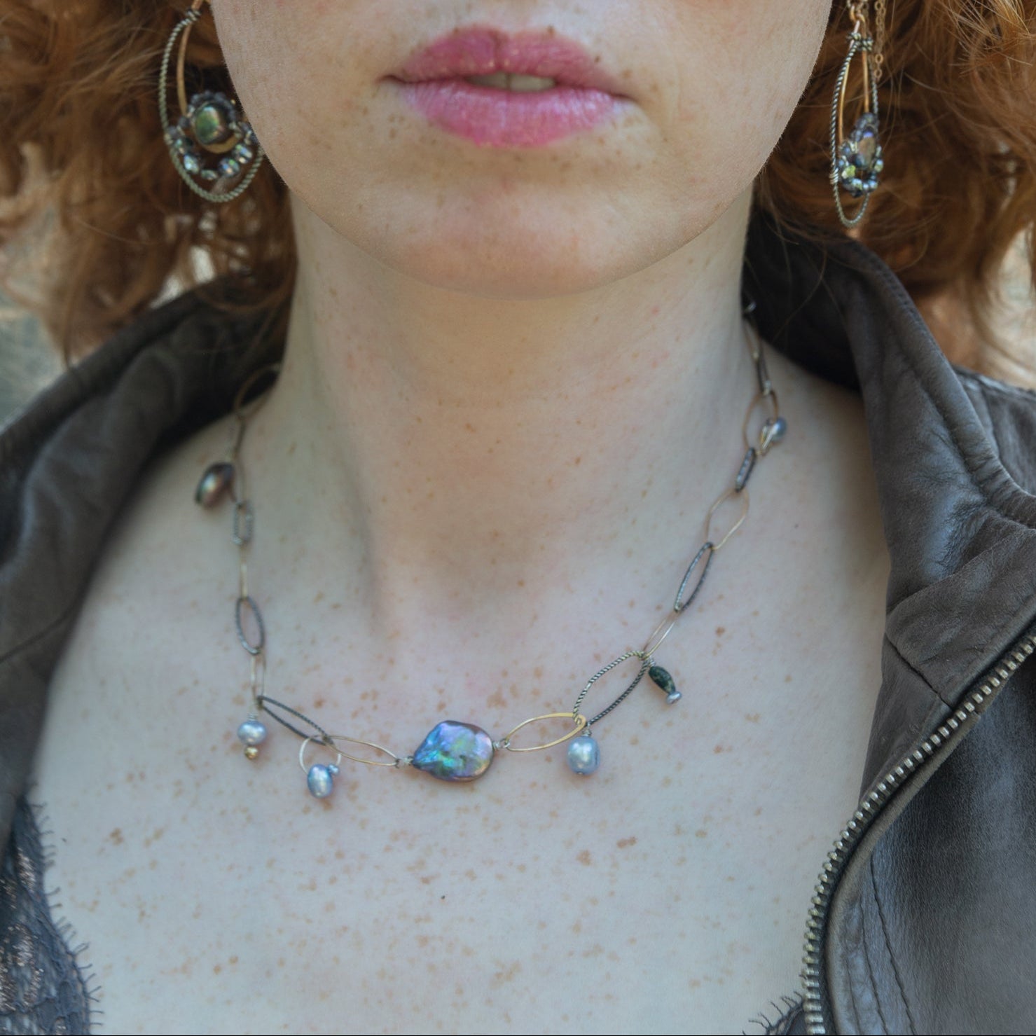 Purple/blue fresh water pearl array, gold-filled links, and sparkly oxidized sterling silver links to form a charm necklace