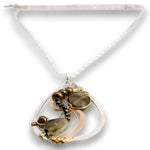 A teardrop-shaped pendant necklace featuring a white mother-of-pearl frame, a large smoky brown teardrop gemstone, a smaller round smoky brown stone, and bronze beads, suspended from a delicate white chain.