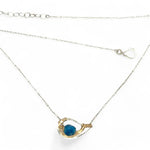Necklace with a blue pendant on a white background