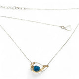 Necklace with a blue pendant on a white background