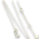 Three delicate gold chain necklaces with oval link details and a lobster clasp pendant, arranged diagonally on a white background.