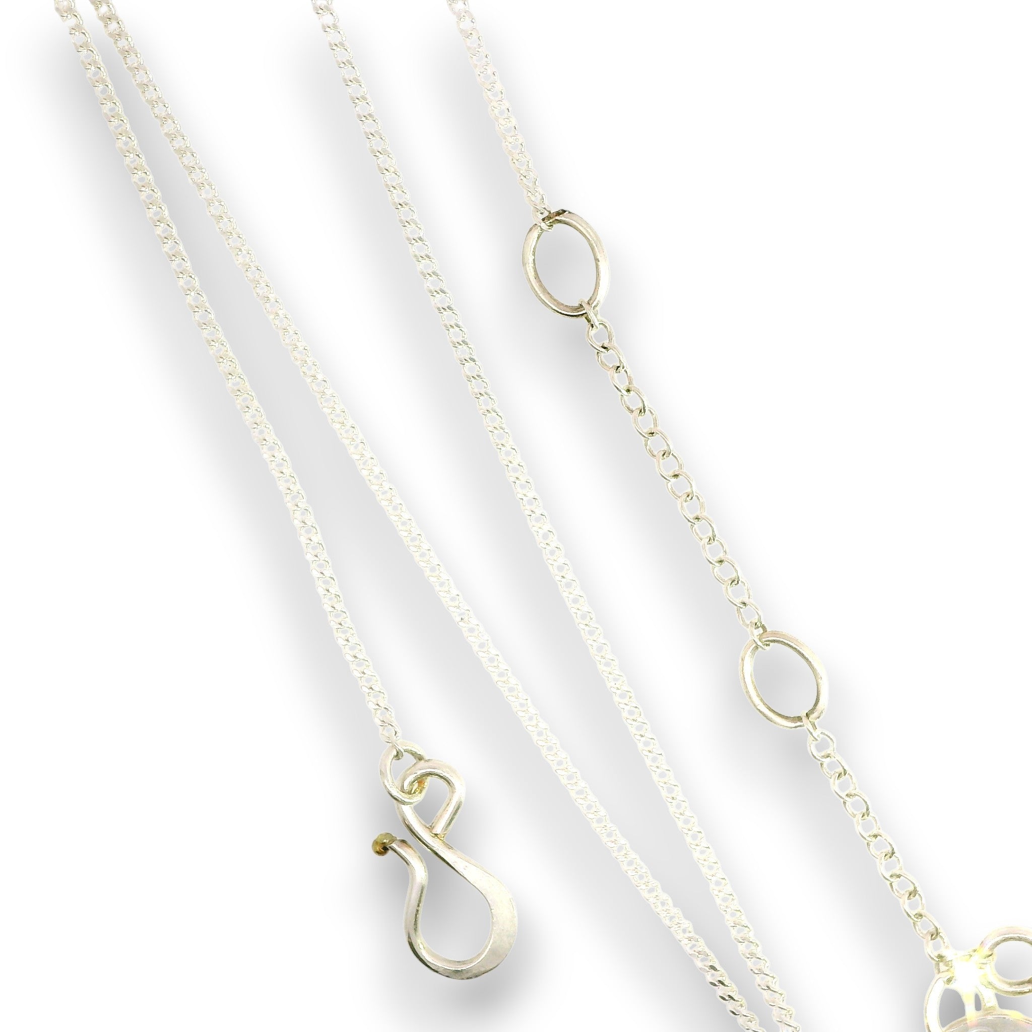Three delicate gold chain necklaces with oval link details and a lobster clasp pendant, arranged diagonally on a white background.