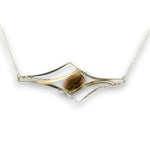 Sterling silver pendant with smoky quartz rectangle with silver and gold-filled curves on delicate silver chain.
