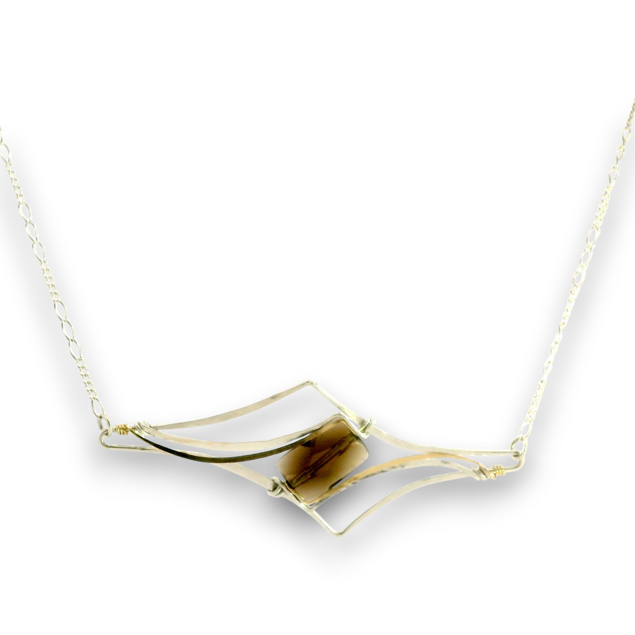 A gold-toned necklace featuring a geometric open-frame pendant with a central brown tiger's eye stone, shown against a plain white background.