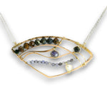 A gold and silver wire-wrapped necklace featuring multiple strands of gemstone beads, including brown, green, purple, and pale blue stones, displayed on a clean white background.