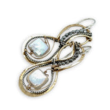 brass infinity shaped earrings are lined with oxidized sterling silver twist with pyrite and fresh water pearl tile accents