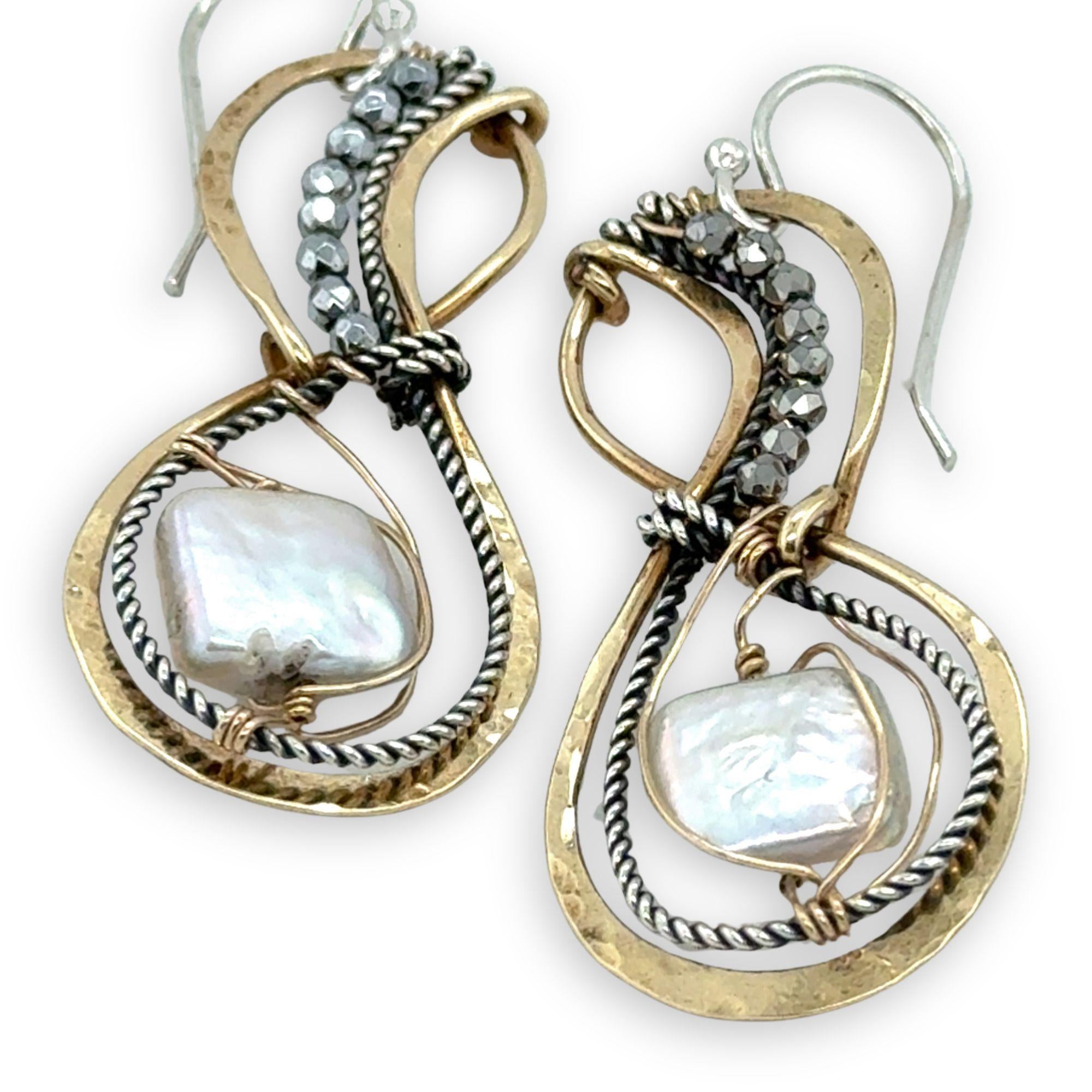 brass infinity shaped earrings are lined with oxidized sterling silver twist with pyrite and fresh water pearl tile accents