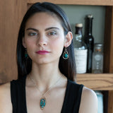 A pair of sterling silver drop earrings with gold filled wire, featuring chrysocolla drop gemstones, chocolate freshwater pearls, and chocolate striped agate.