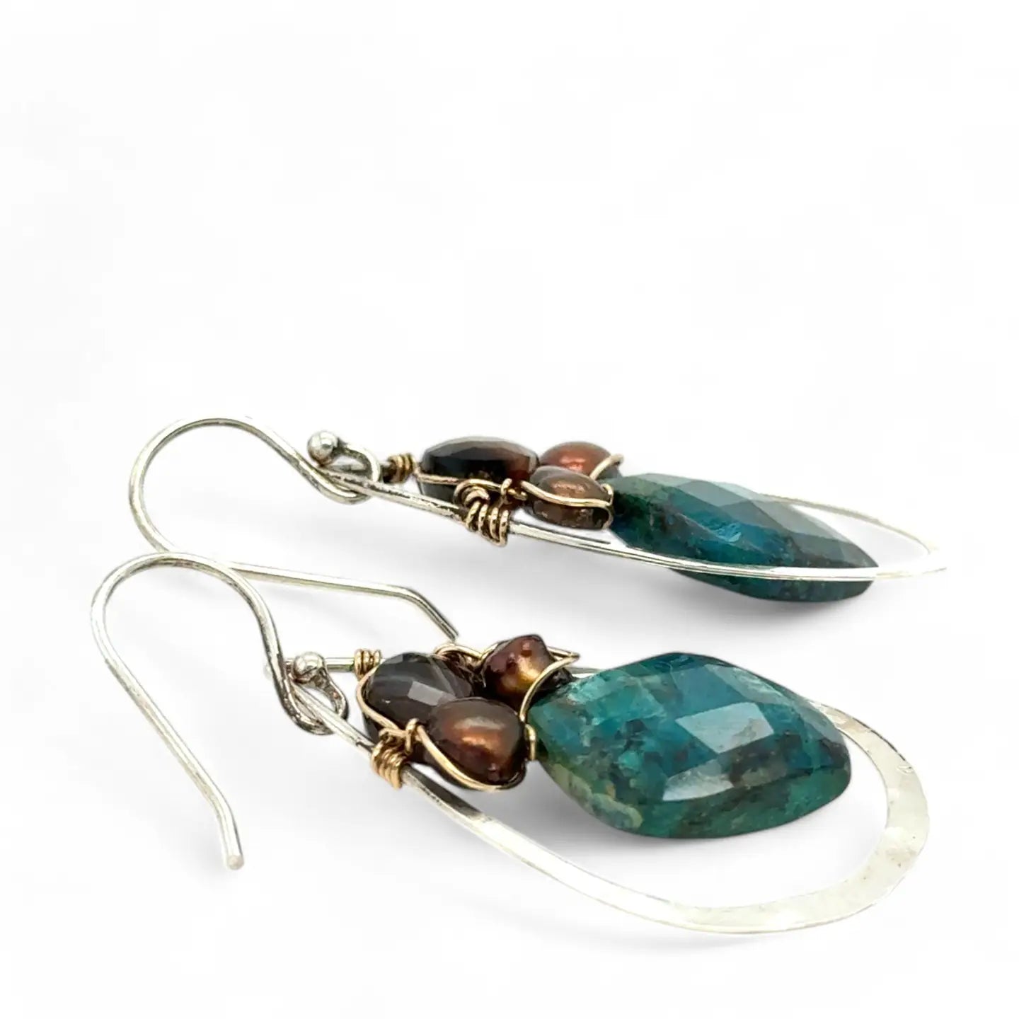 A pair of sterling silver drop earrings with gold filled wire, featuring chrysocolla drop gemstones, chocolate freshwater pearls, and chocolate striped agate.