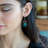 A pair of sterling silver drop earrings with gold filled wire, featuring chrysocolla drop gemstones, chocolate freshwater pearls, and chocolate striped agate.