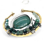  brass cup necklace with smooth african opal jasper oval wrapped in hammered sterling silver, oxidized sterling twist, emerald gemstones, and crystal