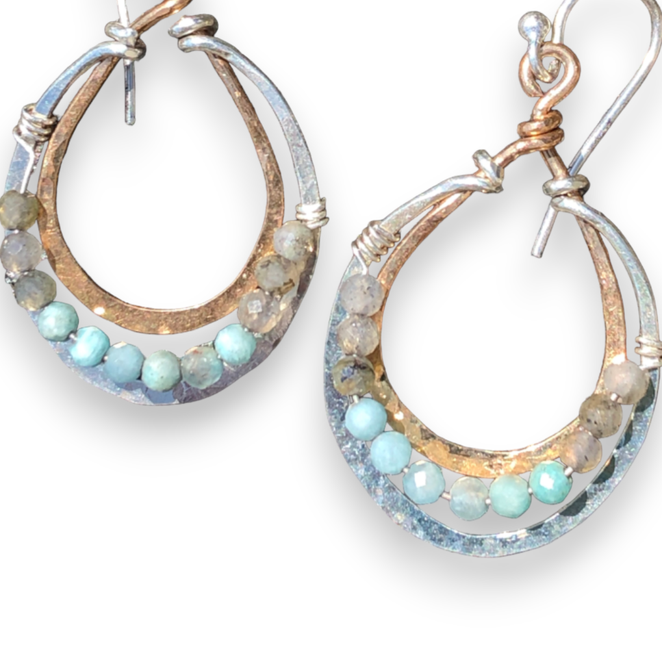 A pair of sterling silver and bronze channel hoop earrings featuring amazonite and labradorite gemstones