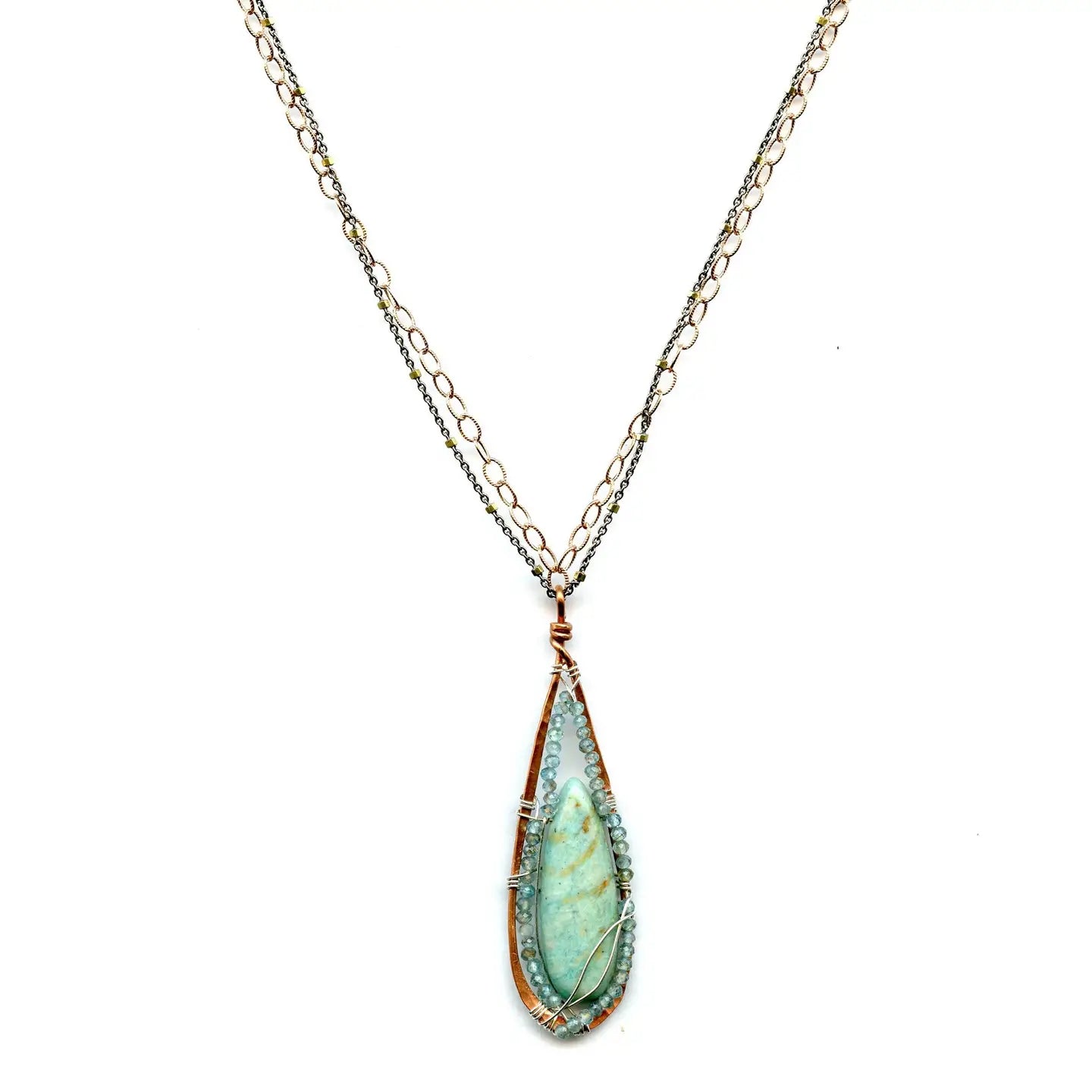 a smooth amazonite drop is wrapped tightly in apatite gemstones and sterling silver wire in a handmade hammered copper drop pendant hanging from a double gold filled and oxidized sterling silver chain necklace