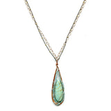 a smooth amazonite drop is wrapped tightly in apatite gemstones and sterling silver wire in a handmade hammered copper drop pendant hanging from a double gold filled and oxidized sterling silver chain necklace