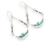 A pair of sterling silver earrings with hammered swing design, featuring faceted gemstones such as amazonite, opal, and apatite, and bronze mini rings.