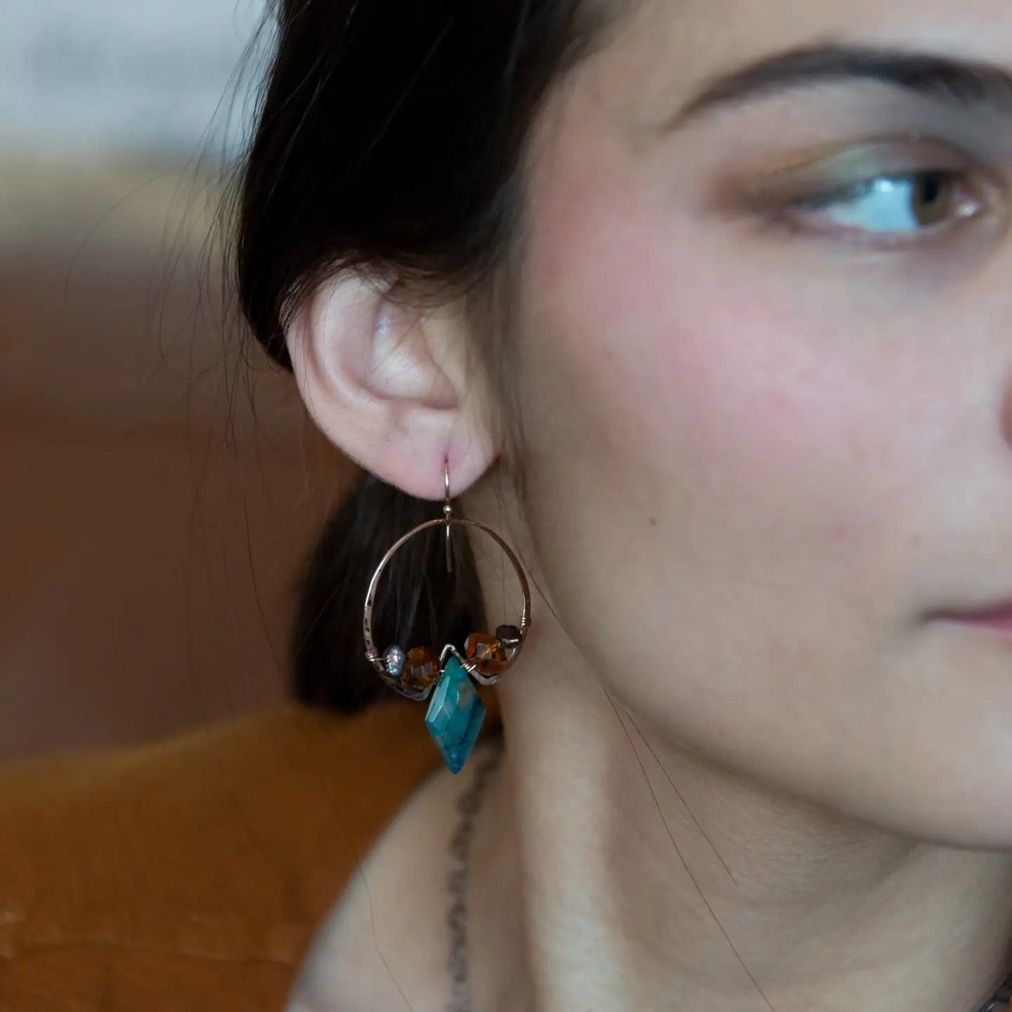 Chrysocolla diamonds are held within bronze hammered hoop earrings with amber crystal and chocolate fresh water pearl accents