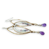 Faceted amethyst drops hang from a brass marquise earring with hammered sterling silver arches and faceted fluorite gemstones