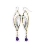 Faceted amethyst drops hang from a brass marquise earring with hammered sterling silver arches and faceted fluorite gemstones