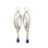 Faceted amethyst drops hang from a brass marquise earring with hammered sterling silver arches and faceted fluorite gemstones