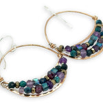 handmade hammered bronze channel hoops with a mix of amethyst, chrysocolla, pyrite, and crystal cube gemstones on sterling silver wire