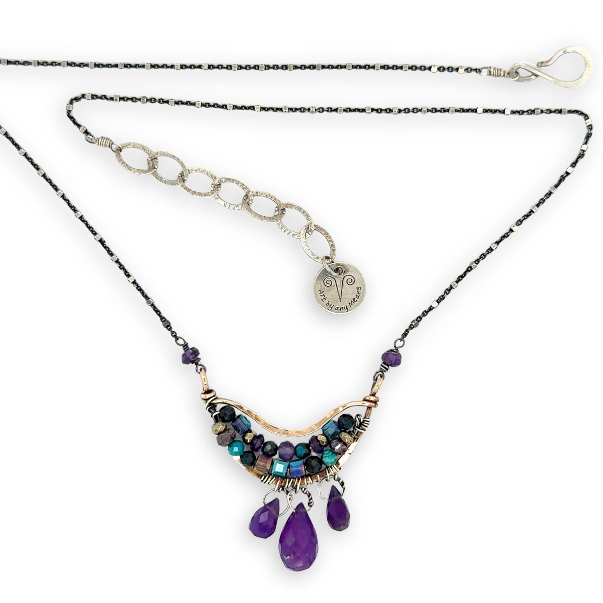 Handmade hammered bronze mini pendant embellished with amethyst, chrysocolla, pyrite, and crystal cubes with faceted amethyst drops hanging from the bottom, on oxidized sterling silver dot chain