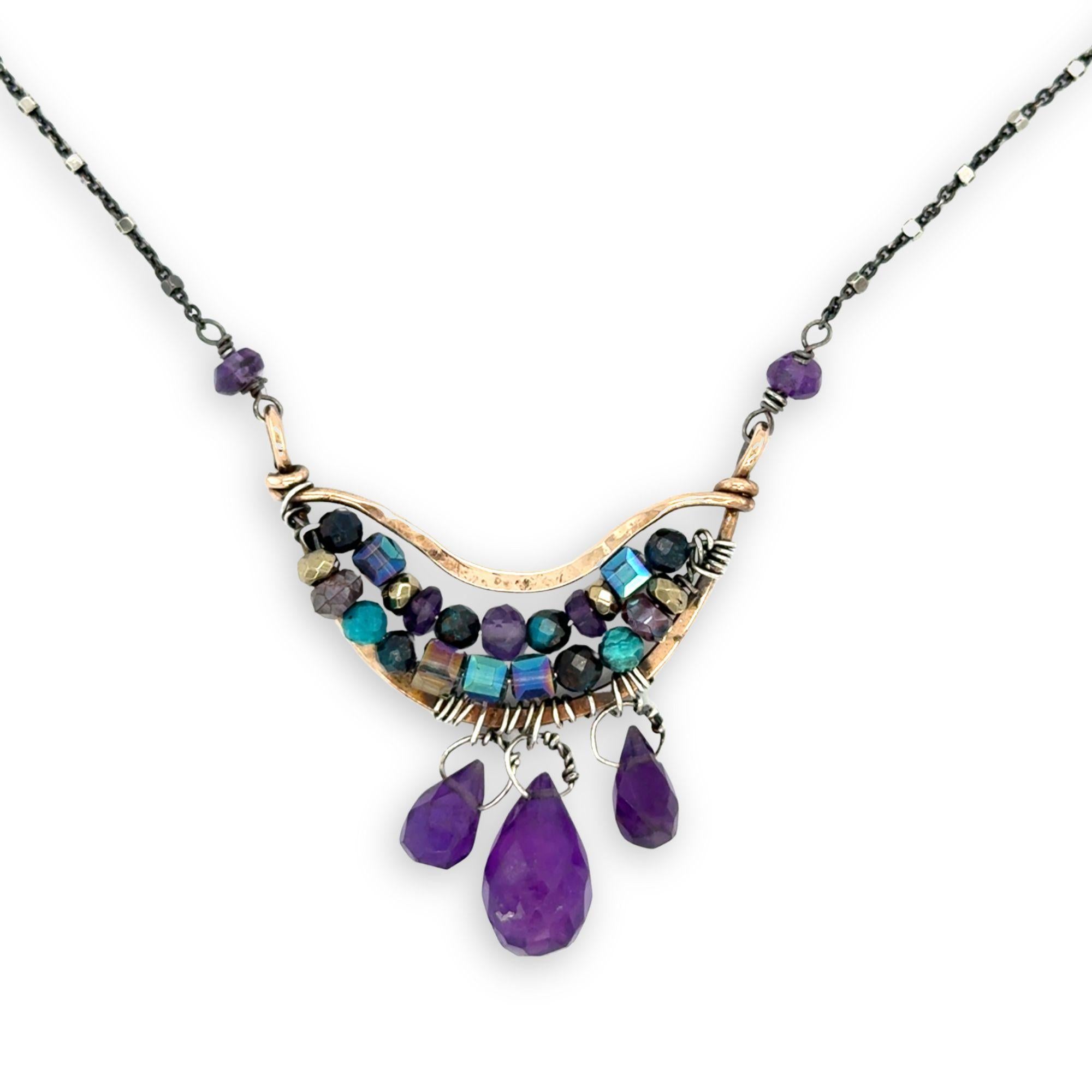 Handmade hammered bronze mini pendant embellished with amethyst, chrysocolla, pyrite, and crystal cubes with faceted amethyst drops hanging from the bottom, on oxidized sterling silver dot chain