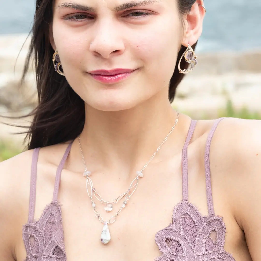 Dandelion stamped sterling silver drop earrings with snaking hammered bronze wire and oxidized sterling twist wire accented with amethyst cubes, cubic zirconia, and fluorite gemstones with built in post style earring hooks