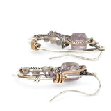 Dandelion stamped sterling silver drop earrings with snaking hammered bronze wire and oxidized sterling twist wire accented with amethyst cubes, cubic zirconia, and fluorite gemstones with built in post style earring hooks