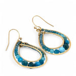 A pair of brass channel hoop earrings with blue apatite gemstones, featuring gold-filled French hooks.