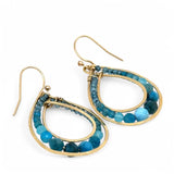A pair of brass channel hoop earrings with blue apatite gemstones, featuring gold-filled French hooks.