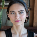 A garden of apatite and chrysocolla gemstones held in veins of gold filled wire attached to a mini handmade sterling silver oval earring with bronze swish accent