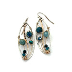 A garden of apatite and chrysocolla gemstones held in veins of gold filled wire attached to a mini handmade sterling silver oval earring with bronze swish accent