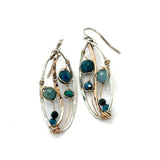 A garden of apatite and chrysocolla gemstones held in veins of gold filled wire attached to a mini handmade sterling silver oval earring with bronze swish accent