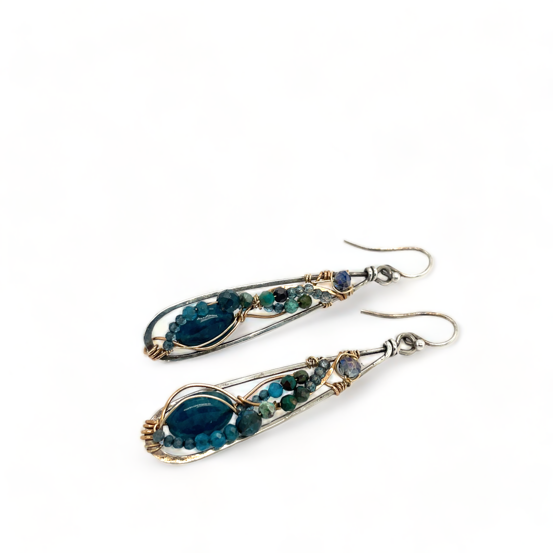 Apatite gemstones accented with blue quartz, chrysocolla, crystal, and bright apatite gemstones wrapped in bronze and gold filled wire inside darkened sterling silver long drop earrings