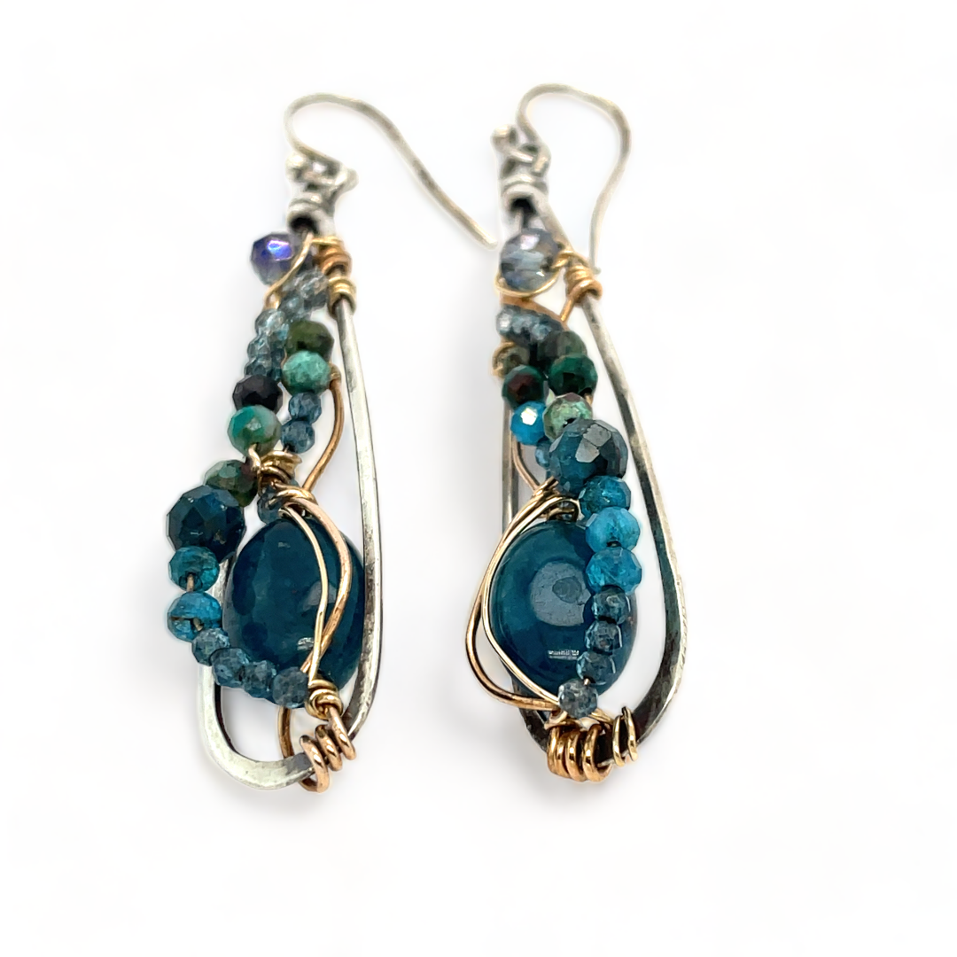 Apatite gemstones accented with blue quartz, chrysocolla, crystal, and bright apatite gemstones wrapped in bronze and gold filled wire inside darkened sterling silver long drop earrings