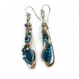 Apatite gemstones accented with blue quartz, chrysocolla, crystal, and bright apatite gemstones wrapped in bronze and gold filled wire inside darkened sterling silver long drop earrings