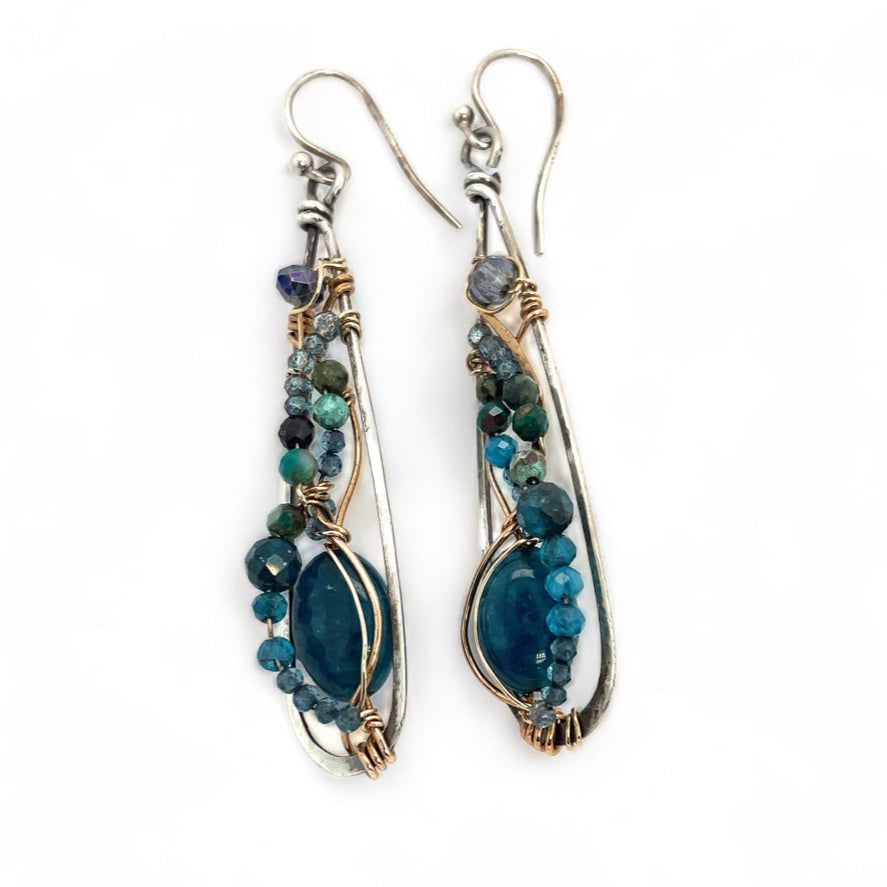 Apatite gemstones accented with blue quartz, chrysocolla, crystal, and bright apatite gemstones wrapped in bronze and gold filled wire inside darkened sterling silver long drop earrings