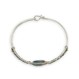 Sterling silver slim bracelet with a smooth apatite tile center surrounded by hammered brass and pyrite gemstone accents
