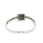Sterling silver slim bracelet with a smooth apatite tile center surrounded by hammered brass and pyrite gemstone accents