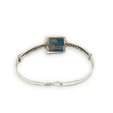Sterling silver slim bracelet with a smooth apatite tile center surrounded by hammered brass and pyrite gemstone accents
