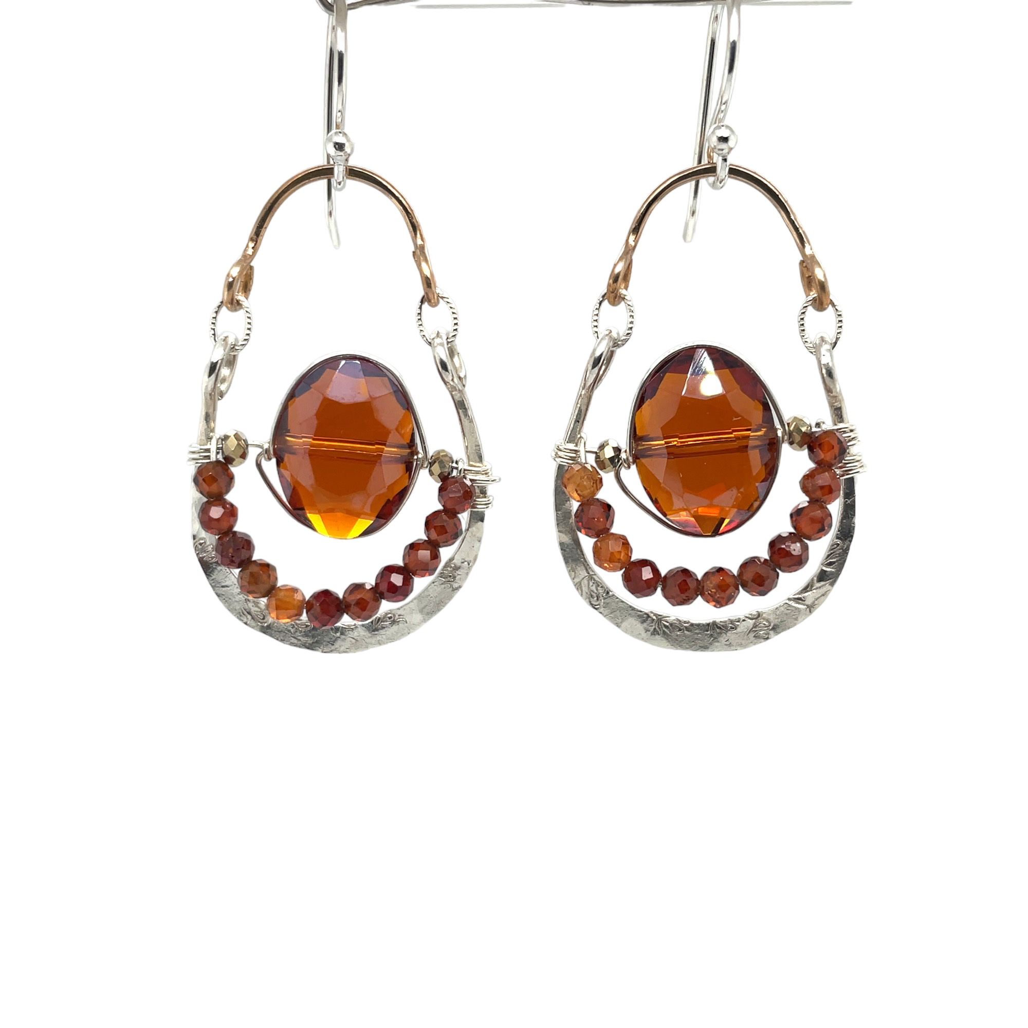 Red/orange oval crystal and hessonite garnet gemstones sit inside a hammered sterling silver and bronze hoop earring